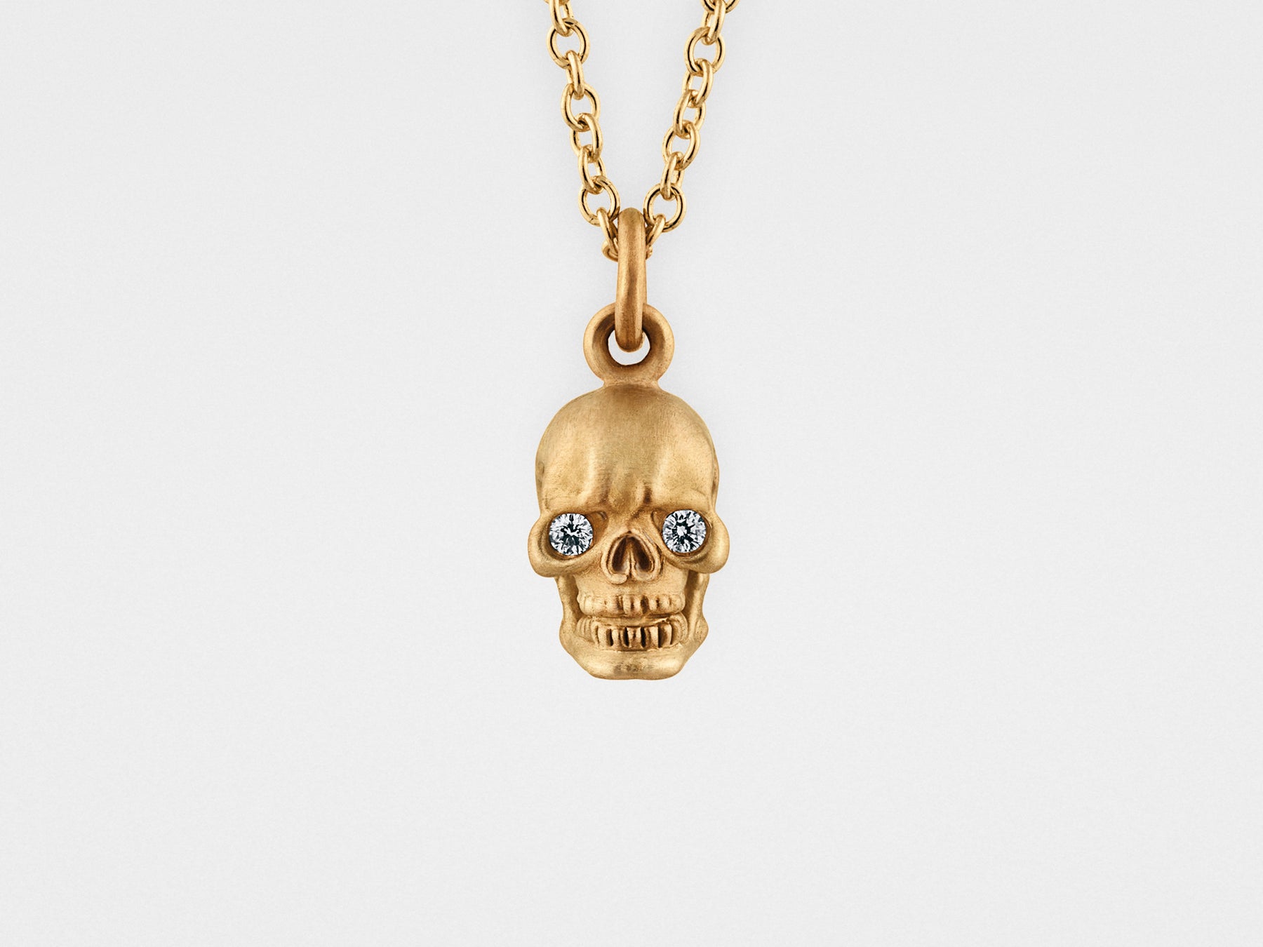 Skull Pendant Necklace in 18kt Gold Snake Bones