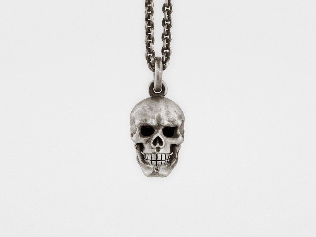 Skull Pendant with Hinged Jaw and Diamond Eyes in Sterling Silver